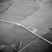 Oblique aerial view centred on the barrow, taken from the N.