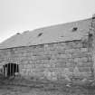 View from S of S end of range containing threshing barn, showing slate roof, coped gable and cart entrance