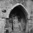 Oronsay Priory, interior.
View of arch to sacristy with effigy beneath.
