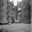 Edinburgh, Charles Street, general.
View of back of houses with three children standing by door.