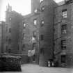 Edinburgh, Charles Street, general.
View of back of houses with children standing by door and washing hanging out.