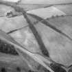 Newstead, Roman fort and temporary camps: air photograph showing Eastern annexe (NT 572 343), and 'Great camp' complex of temporary camps (NT 574 341). Also shows pit-alignment and linear feature (NT 576 343 to NT 577 339) at Broomhill
