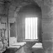 Interior.
View of window with stone benches on second floor wing.