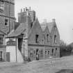 View of Abbey Sanctuary, Edinburgh.
Album page titled: 'Abbey Strand (Lucky Spence's House)'
Original negative envelope captioned: 'Old House Foot of Canongate'

