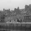 View of The Shore, Leith, showing William Rutherford pub, Thiems’ Foreign Ship Hotel and Coffee & Billiard Rooms, J G Campbell Perfumer and Hairdresser and R & D Slimon Ironmongers and Coppersmith.
