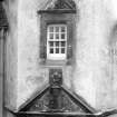 Detail of doorway and window in corner tower.