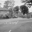 View of South Lodge and gatepiers with memorial stone to Viscount Melville and William Pitt to right of entrance gates.