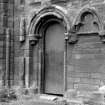 Historic photographic detail of doorway in SE angle of S transept.
