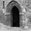 Historic photograph showing detail of entrance doorway to sacristy.