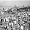 Crowded riverside with bathers and ferry near Chandpal Ghat, Kolkata.  The jetty collapsed in the 1950's.