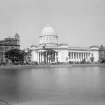 General Post Office seen across the Lal Dighi (water tank), with the Royal Insurance Buildings to the left and the Collectorate Buildings to the right, Kolkata.