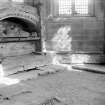 Interior.
View of funerary monument under NE window.