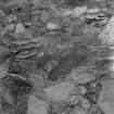 Eileach An Naoimh, Grave.
View of grave partly under foudations in Southern graveyard.