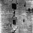 View of damaged wall in old tower.