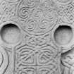 Aberlemno no 2, the Churchyard stone.
Detail of face, showing spiralwork on central boss, and interlace on shaft of cross