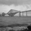 General view from the South West.
Insc. 'The Forth Bridge. Length including Viaduct 8098 Ft. Height 369 Ft. Spans 1710 Ft each.  165.'
