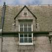 Detail of dormer with carved panel on south face of east block of castle