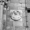 Detail showing roundel, courtyrard front of east range.