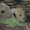 Detail of carved mill stones in chapel interior.