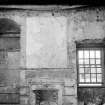 Interior.
View of painted wall above fireplace, recess and window.