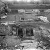 View of coffins in chapter house at Melrose Abbey during excavation in 1921.