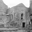 North East corner of court, showing stairway, original position of arches & roof