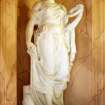 View of statue of female figure (Panacea?), on E side of vestibule of main entrance.