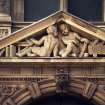 View of pair of putti, in triangular pediment above entrance to Jenners on South St David Street, Edinburgh.