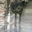 View of capital of niche on N wall (enclosing statue representing Charity), carved with a bear attacking a dragon.