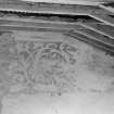 View of painted plasterwork in room on top floor.