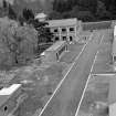 Taymouth Castle, Military Camp.
View of training area - looking East from Rescue Tower towards tennis courts, buildings flanking roadway reading left to right, Casulty Handling, Indoor training, Factory building, Knots and lashings, First aid and Casualties and cloakrooms, a cetylene cuttingshop.