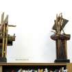 View of sculptures 'Ship of Fools 1' and 'Ship of Fools 2', on top of bookcase in Scottish Poetry Library.