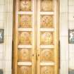 View of wooden doors carved with Scottish coins, at entrance to 42 St Andrew Square.