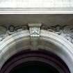 View of carved cherubs, in spandrels of doorway of 28 St Andrew Square.