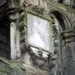 View of panel with angel's head and grotesque mask, above W door of Holyrood Abbey..