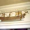 View of ship model relief (central one of three), on upper walls inside Nelson Monument.