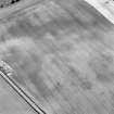 Oblique aerial view of Priest Bank centred on a subcircular cropmark, with the cropmark of an enclosure adjacent.  Taken from the NW.