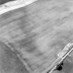 Oblique aerial view of Garvald centred on the cropmark of an enclosure, with a subcircular cropmark adjacent.  Taken from the NE.