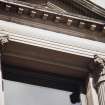 View of carved capitals (two of eight), flanking first floor windows of 142-144 Princes Street.