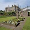 Main house, flower bed and pillar, view from South East.