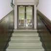 Interior. W staircase, view from landing showing double doors with bar area beyond