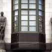 View of sculptures representing Insurance and Security, on top of columns either side of corner entrance to the Guardian royal Exchange, St Andrew Square, Edinburgh.