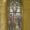 Interior, war memorial chapel, detail of stained glass window at north end