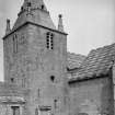 Edinburgh, Kirk Loan, Corstorphine Parish Church.
General view of tower from South, with man raking.