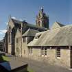 View of church, vestry and kitchen block from east