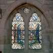 Interior.  View of stained glass window in north wall 'My soul doth magnify the Lord'