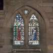 Interior.  View of stained glass window in south wall 'Unto us is born a Saviour'