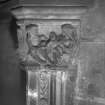 Interior-detail of chimneypiece-capital depicting "family life"