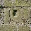 Detail of stone with indentation to inside of West wall.