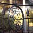 View of portrait of Prince Charles Edward Stuart, in railings to left of pedestal.